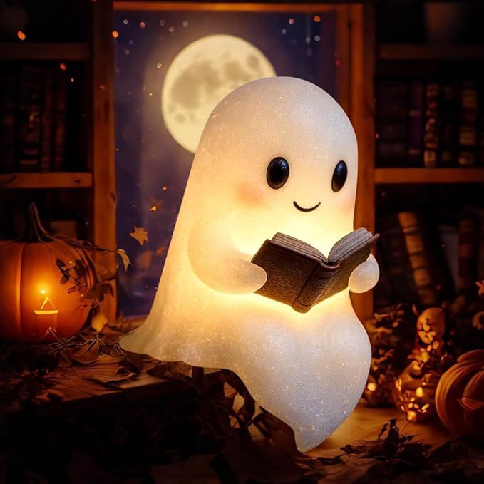 Halloween ghost with a glowing night light on its middle finger