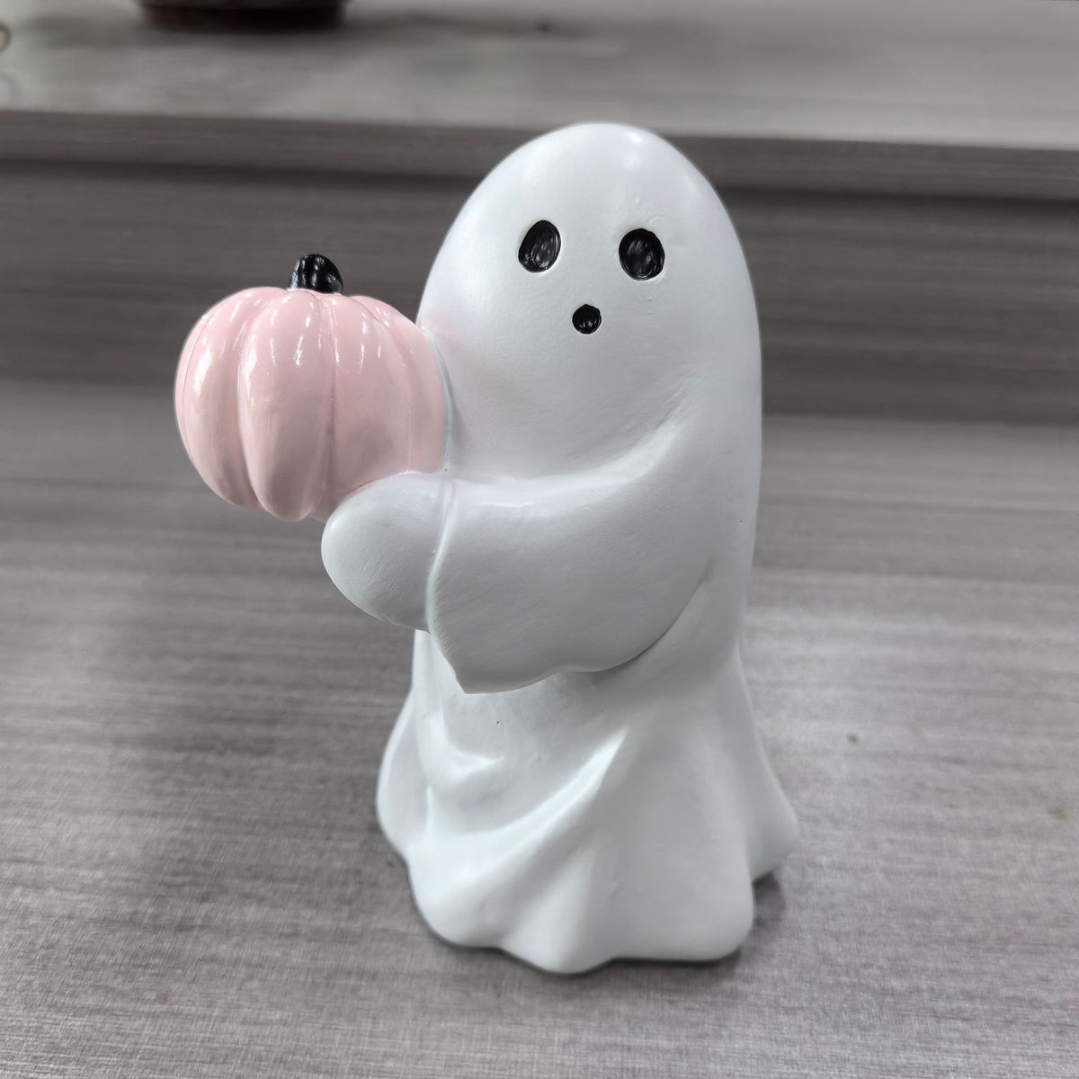 Halloween ghost with a glowing night light on its middle finger