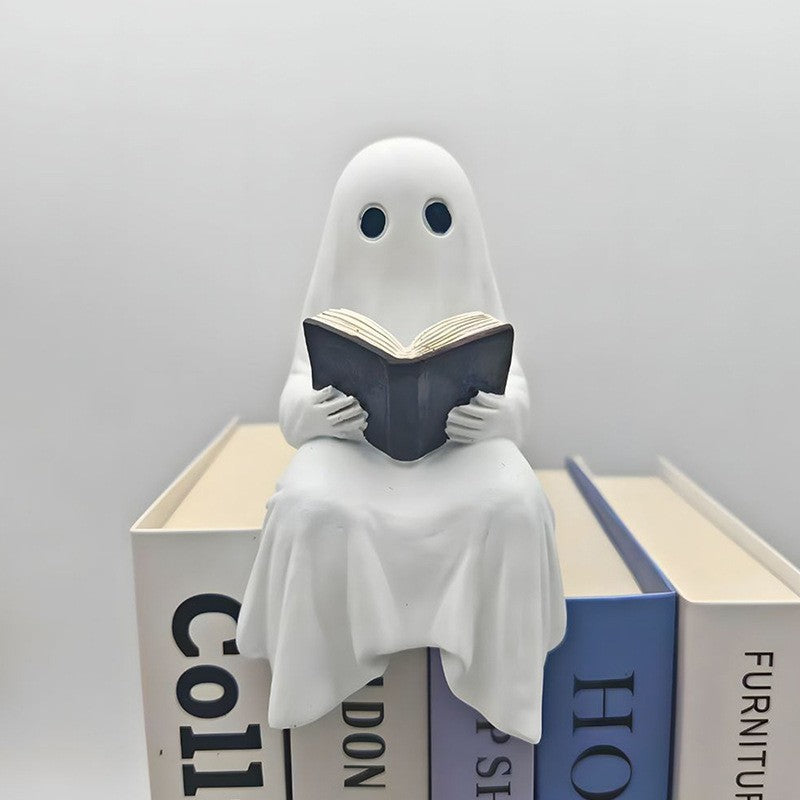 Halloween ghost with a glowing night light on its middle finger